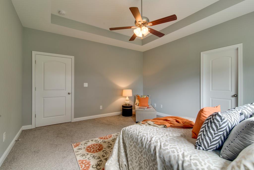 417 Kaiser Road Dickson, TN 37055 - Photo 13 of 30 a bedroom with a bed and a chandelier