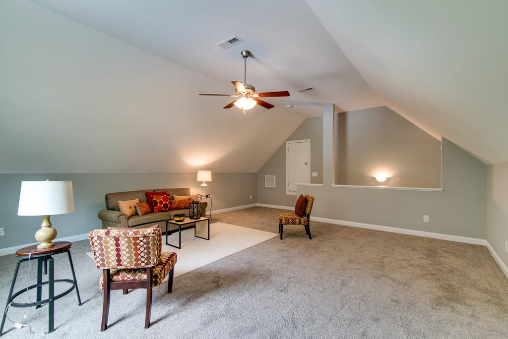 417 Kaiser Road Dickson, TN 37055 - Photo 14 of 30 a living room with furniture and a lamp