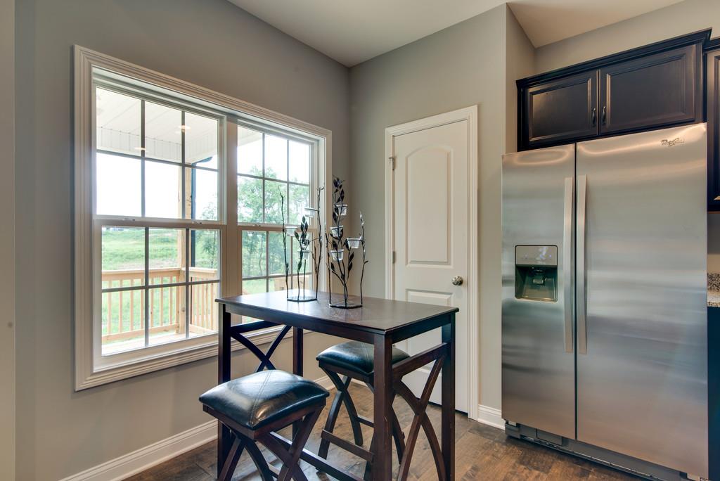 417 Kaiser Road Dickson, TN 37055 - Photo 17 of 30 a view of a dining room with furniture window and wooden floor