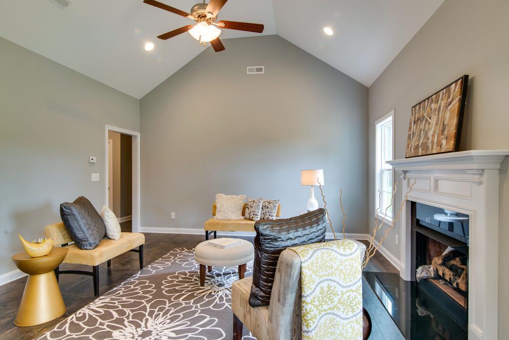 417 Kaiser Road Dickson, TN 37055 - Photo 18 of 30 a living room with furniture and a fireplace