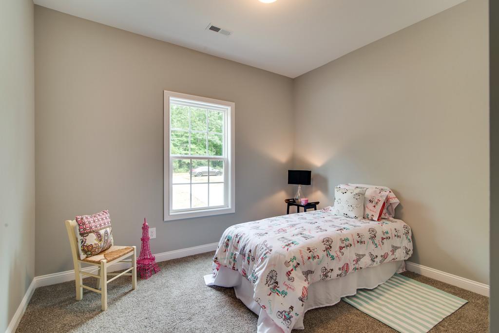 417 Kaiser Road Dickson, TN 37055 - Photo 20 of 30 a bedroom with a bed chair and a window