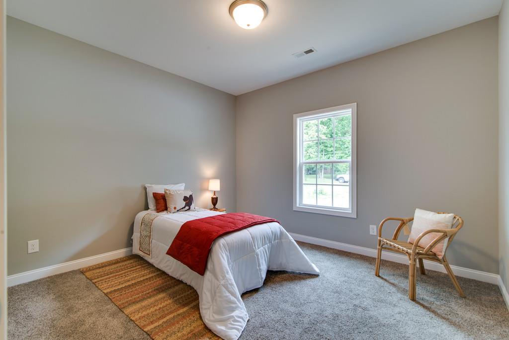 417 Kaiser Road Dickson, TN 37055 - Photo 22 of 30 a bed room with a bed and a chair