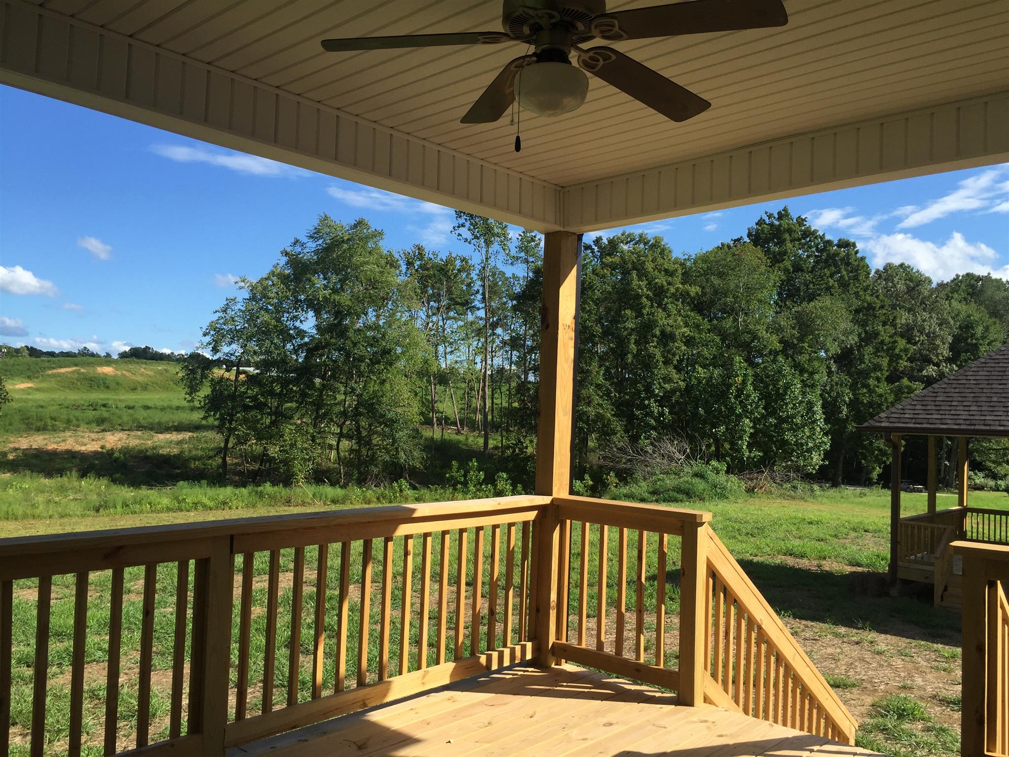 417 Kaiser Road Dickson, TN 37055 - Photo 30 of 30 a view of a balcony with a floor to ceiling window and a table