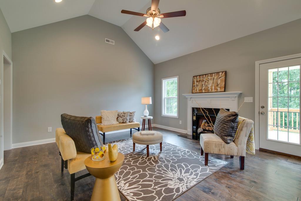 417 Kaiser Road Dickson, TN 37055 - Photo 5 of 30 a living room with furniture and a fireplace