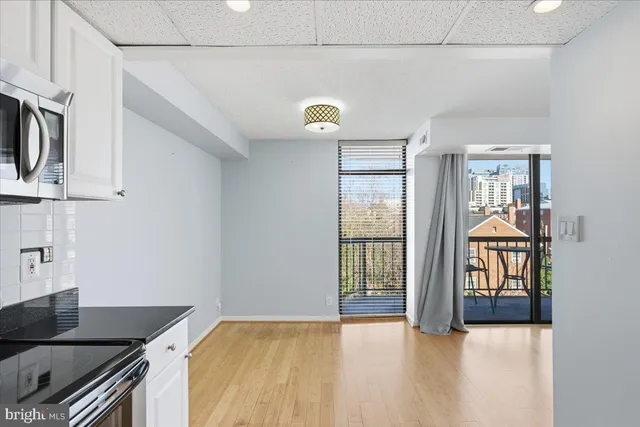 a kitchen with stainless steel appliances granite countertop a stove and a refrigerator
