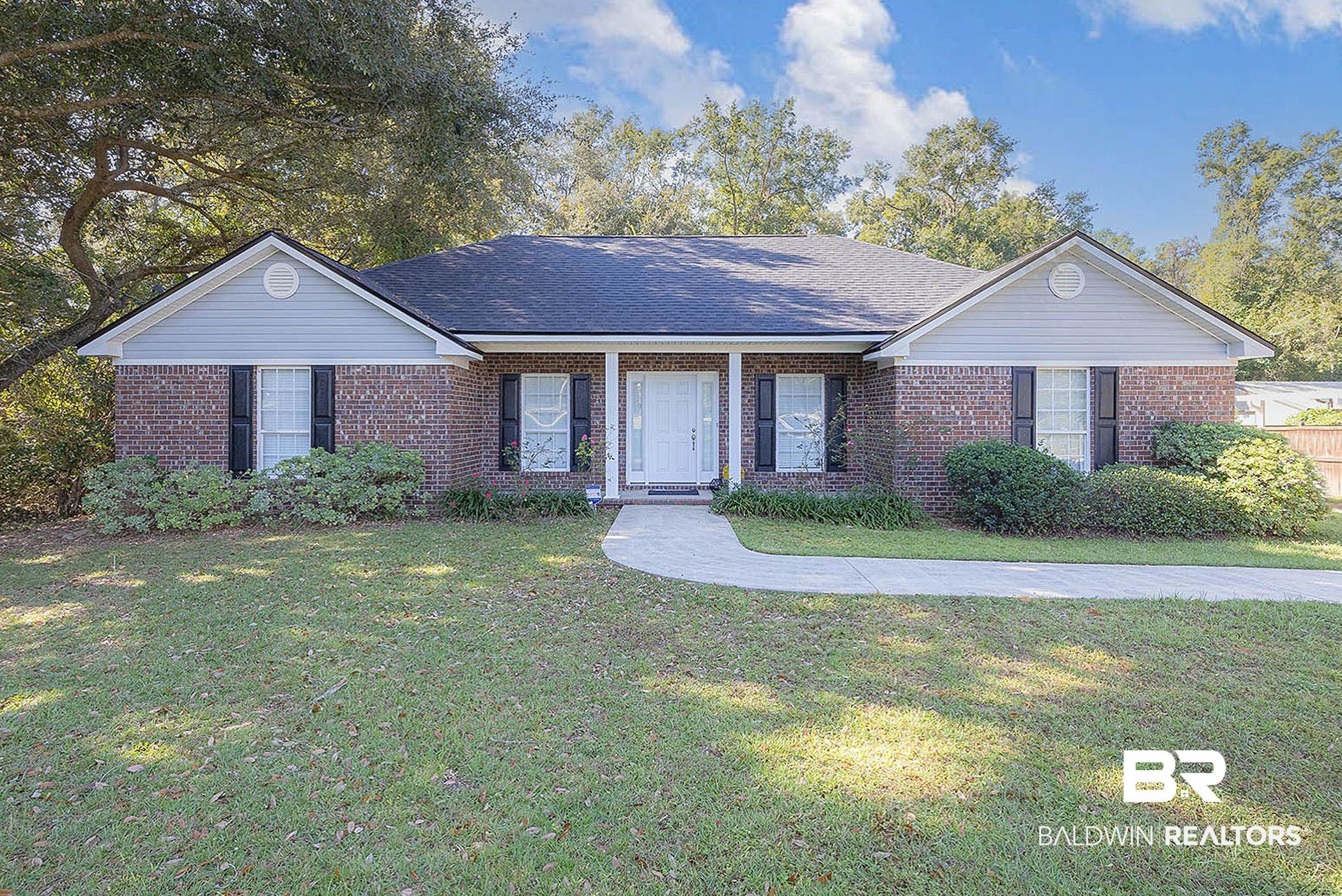 12230 Bromley Road Stapleton, AL 36578 - Photo 1 of 34 Ranch-style home with a front lawn, covered porch, brick siding, and a shingled roof