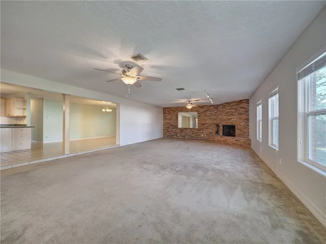 a view of a livingroom and a fireplace