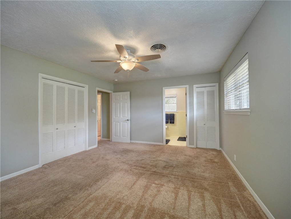 161 Sunset Ingleside, TX 78362 - Photo 15 of 35 a view of a big room with windows and chandelier fan