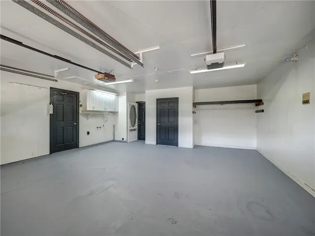 a view of a room with wooden cabinets