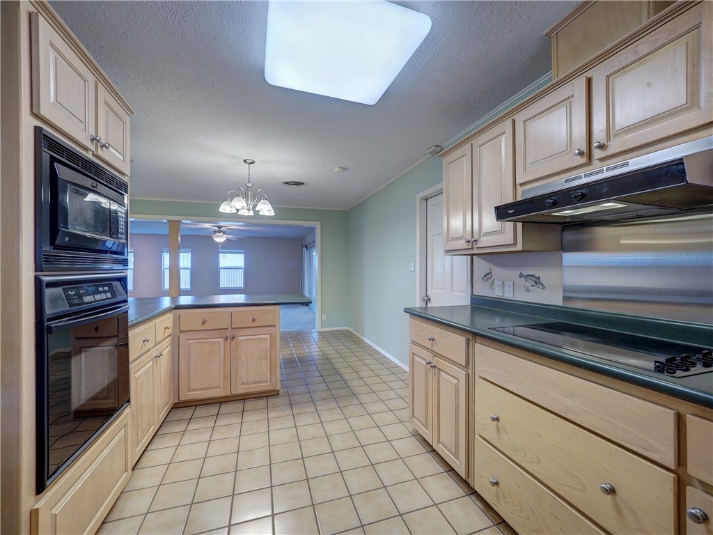 161 Sunset Ingleside, TX 78362 - Photo 4 of 35 a kitchen with stainless steel appliances granite countertop a stove and cabinets