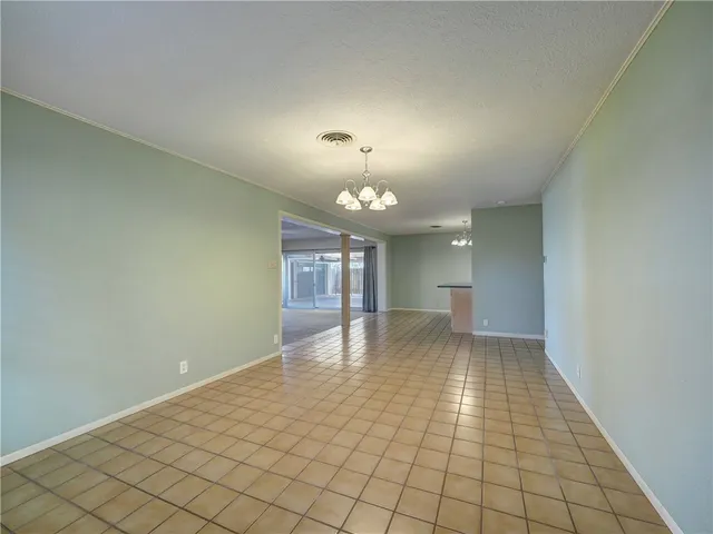a view of a livingroom with a ceiling fan and window