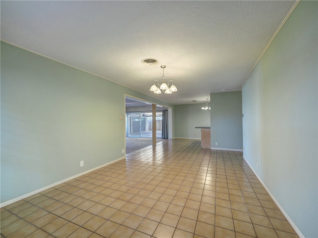 161 Sunset Ingleside, TX 78362 - Photo 9 of 35 wooden floor in an empty room with a window
