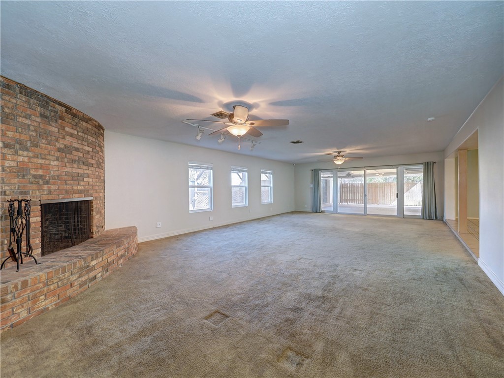 161 Sunset Ingleside, TX 78362 - Photo 10 of 35 a view of a livingroom with a ceiling fan and window
