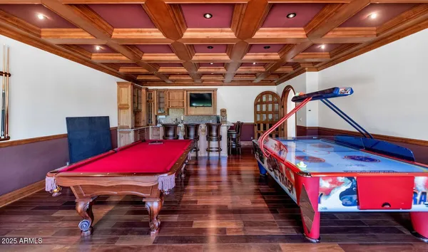 a room with furniture and pool table