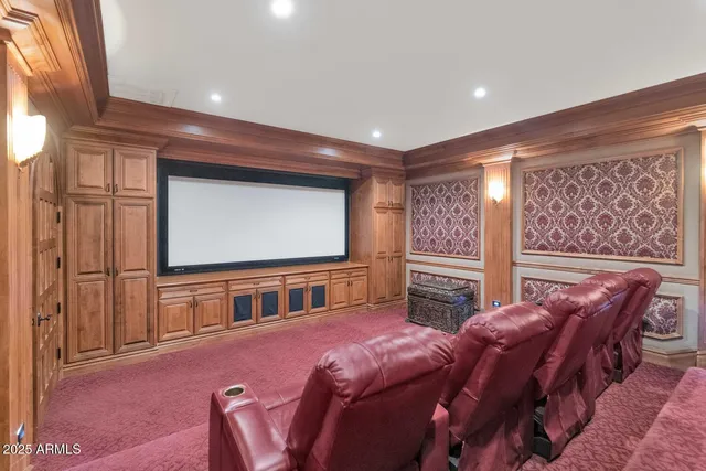 a bedroom with two beds and painted walls