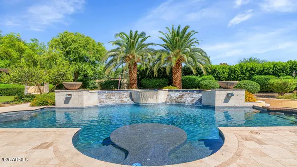 swimming pool view with a garden space