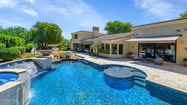a view of a patio with swimming pool table and chairs