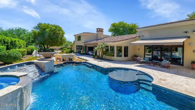 a view of a patio with swimming pool table and chairs