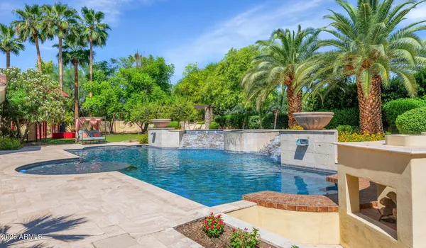 a view of a swimming pool with a patio