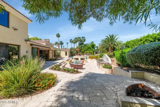 a view of a swimming pool with a patio