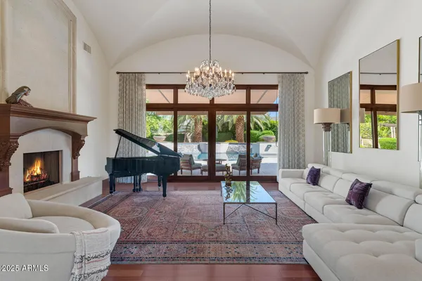 a living room with furniture and a fireplace