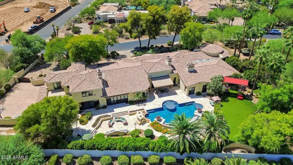 an aerial view of multiple houses with yard