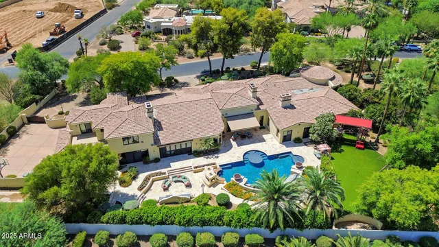 an aerial view of multiple houses with yard