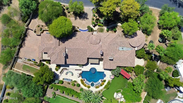 an aerial view of multiple houses with yard