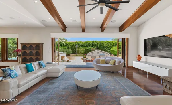 a living room with furniture and a large window
