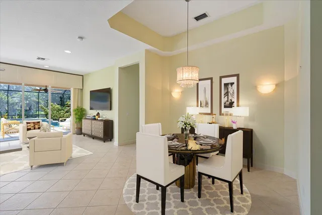 a view of a livingroom with a ceiling fan and window