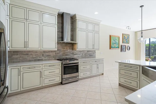 an empty room with windows and a ceiling fan