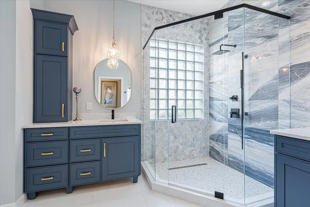 an empty room with a window and a ceiling fan