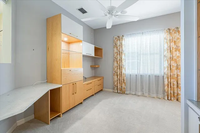 a outdoor space with the couches and dining table with the garden view