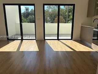 a view of wooden floor and a window