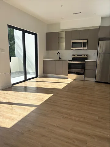 a view of kitchen and microwave