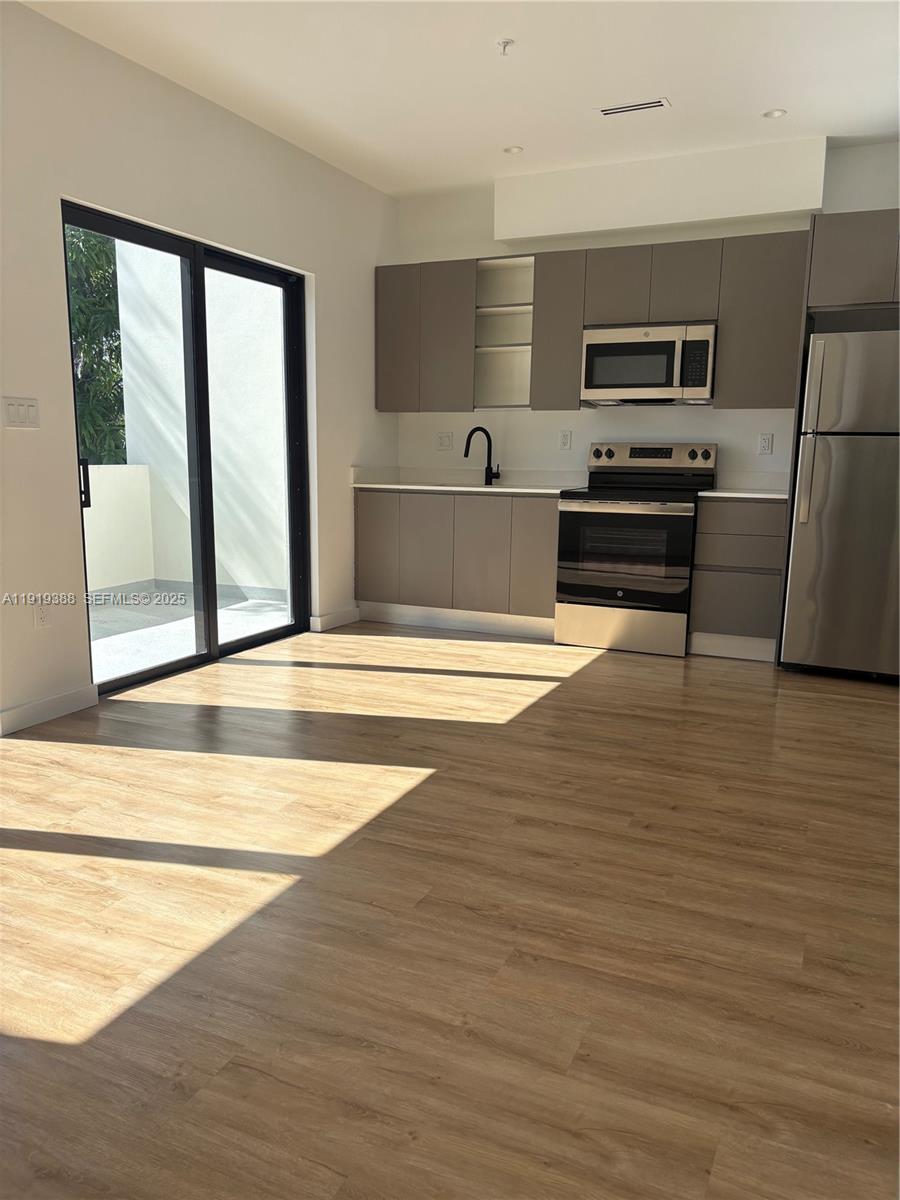 85 Northeast 55th Street, Unit 4 Miami, FL 33137 - Photo 10 of 15 a view of kitchen and microwave