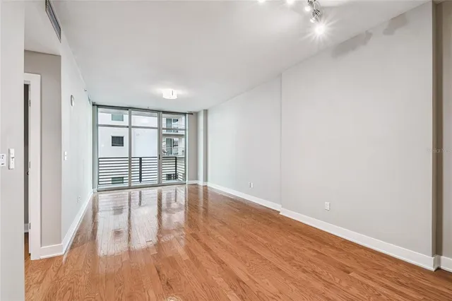 a view of a kitchen with a sink and cabinets