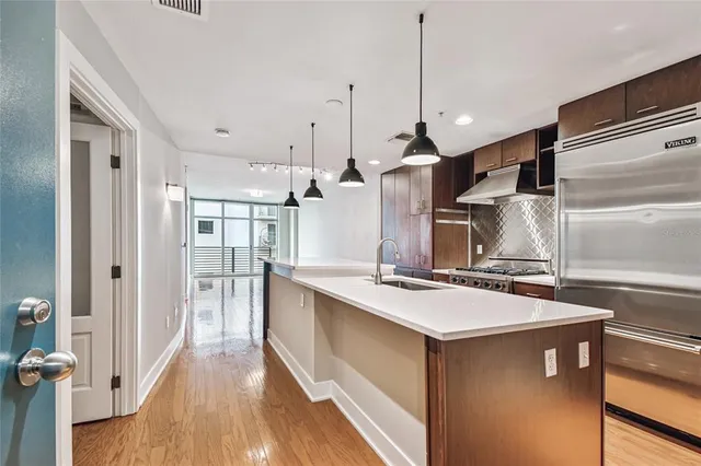 a kitchen with a stove and a refrigerator