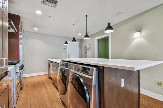 a open kitchen with wooden floor