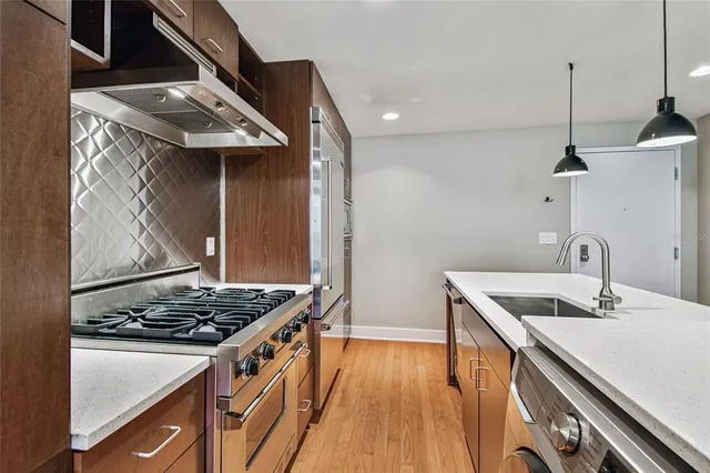 a view of a room with wooden floor and window