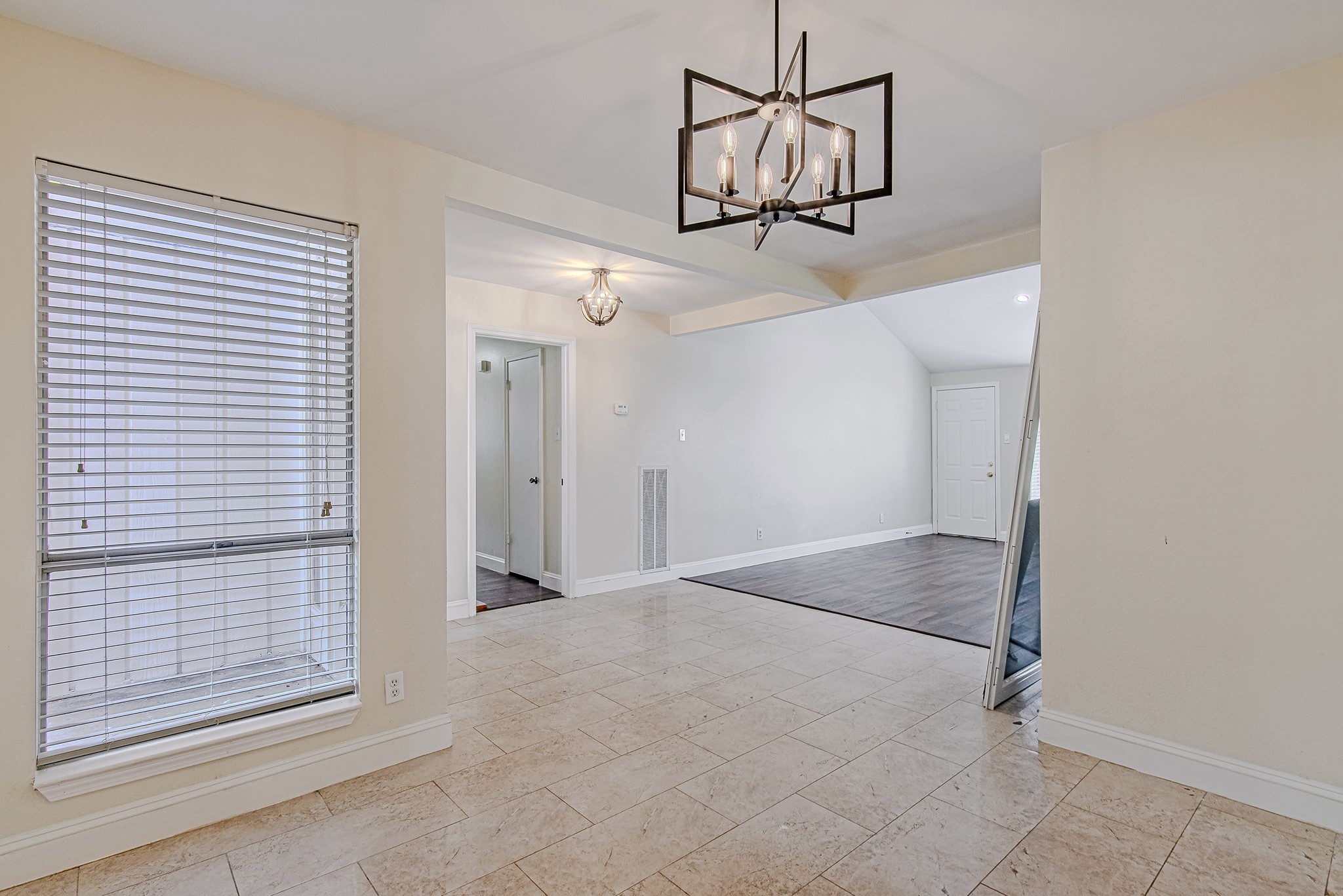 17811 Hawk Haven Lane Spring, TX 77379 - Photo 12 of 22 Open dining and living connection, creating a cohesive and airy feel.