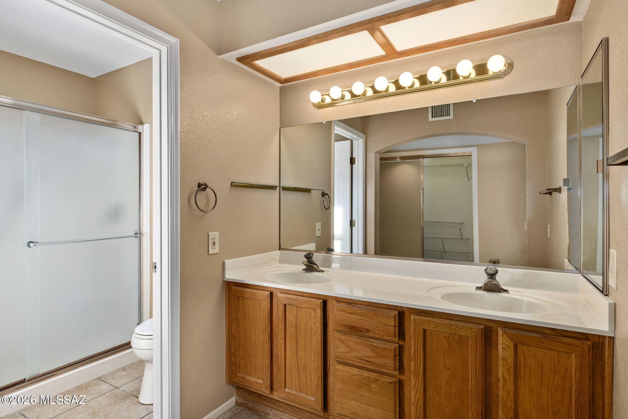 1029 East Rising Sun Drive Oro Valley, AZ 85755 - Photo 24 of 51 OWNER'S EN SUITE BATH W/ WALK IN SHOWER
