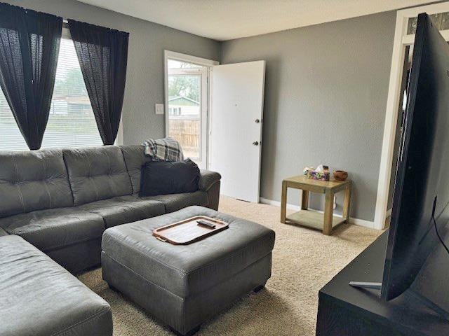 557-28 28 3/4 Road Grand Junction, CO 81501 - Photo 3 of 19 a living room with furniture and a window