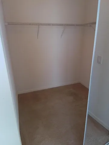 a view of a bathroom from a hallway