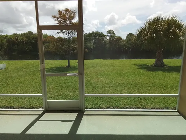 a view of a room with porch and a yard