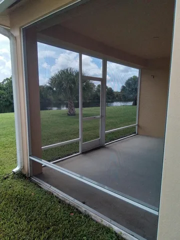 a view of a field with an trees in the background