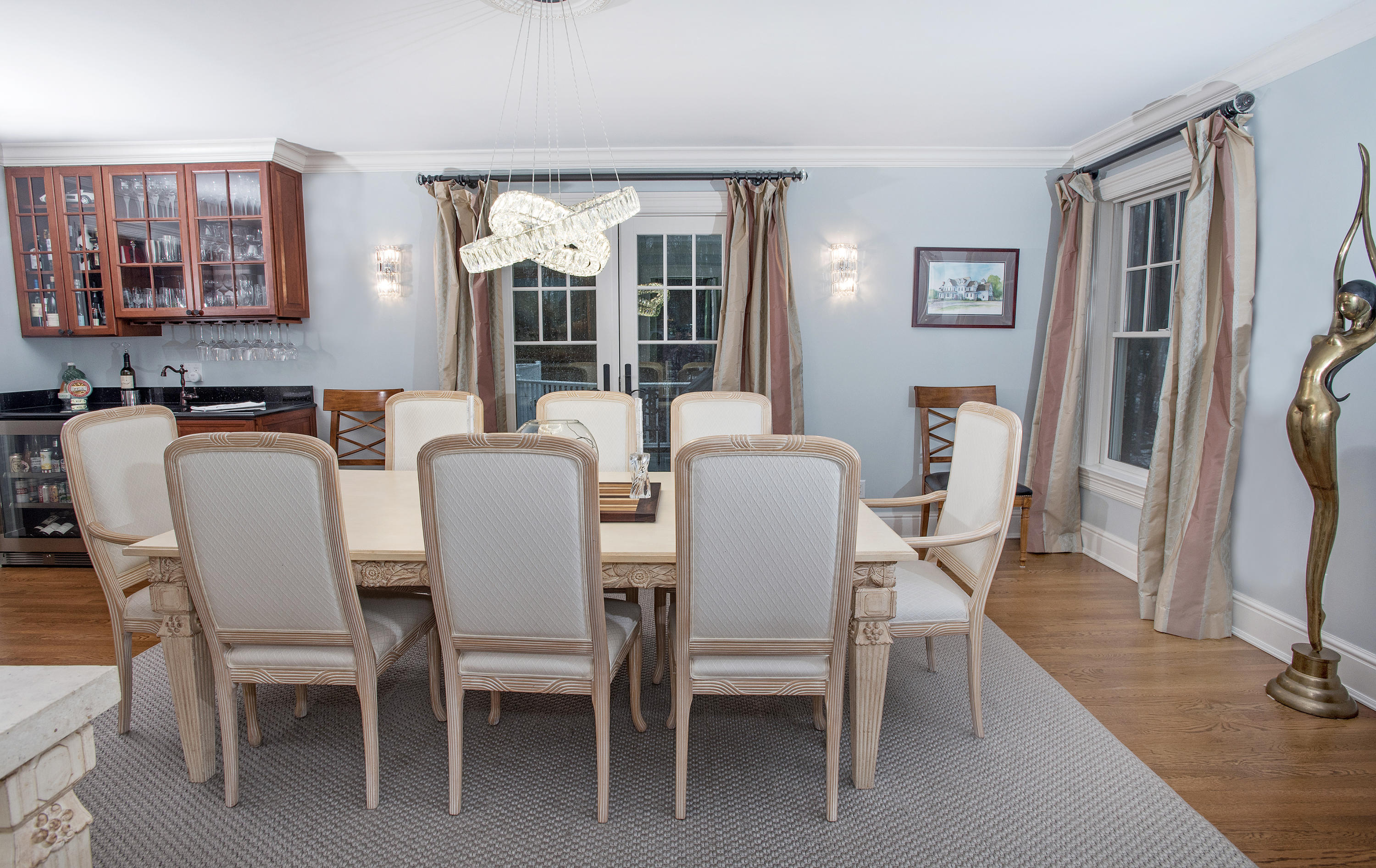 130 Skyview Lane New Canaan, CT 06840 - Photo 15 of 44 a view of a dining room with furniture and a potted plant