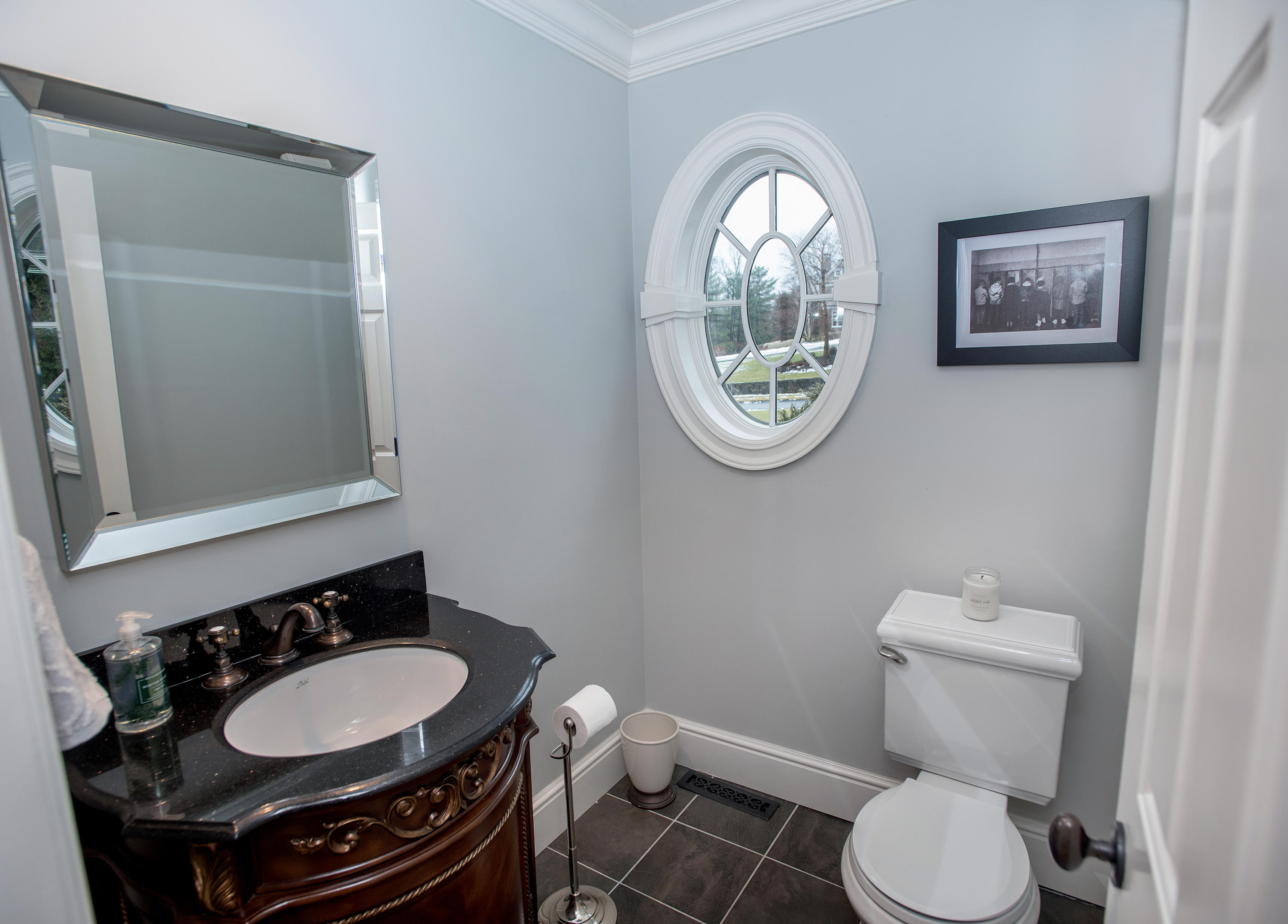 130 Skyview Lane New Canaan, CT 06840 - Photo 17 of 44 a bathroom with a toilet a sink and a mirror