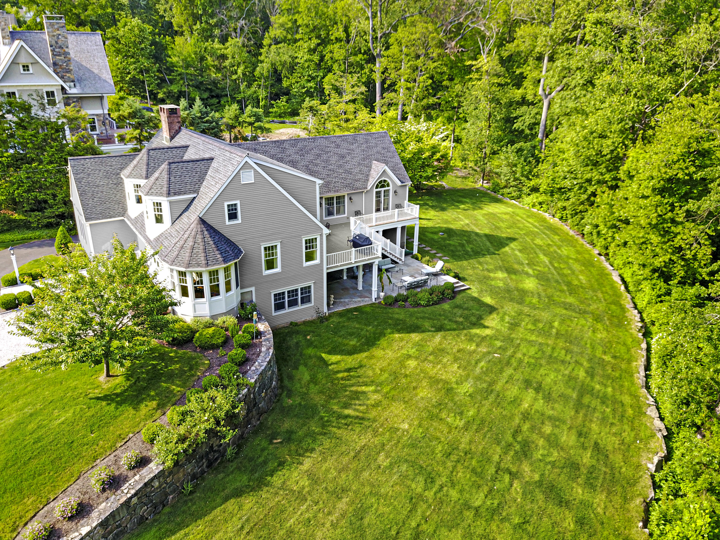 130 Skyview Lane New Canaan, CT 06840 - Photo 2 of 44 an aerial view of a house with a big yard