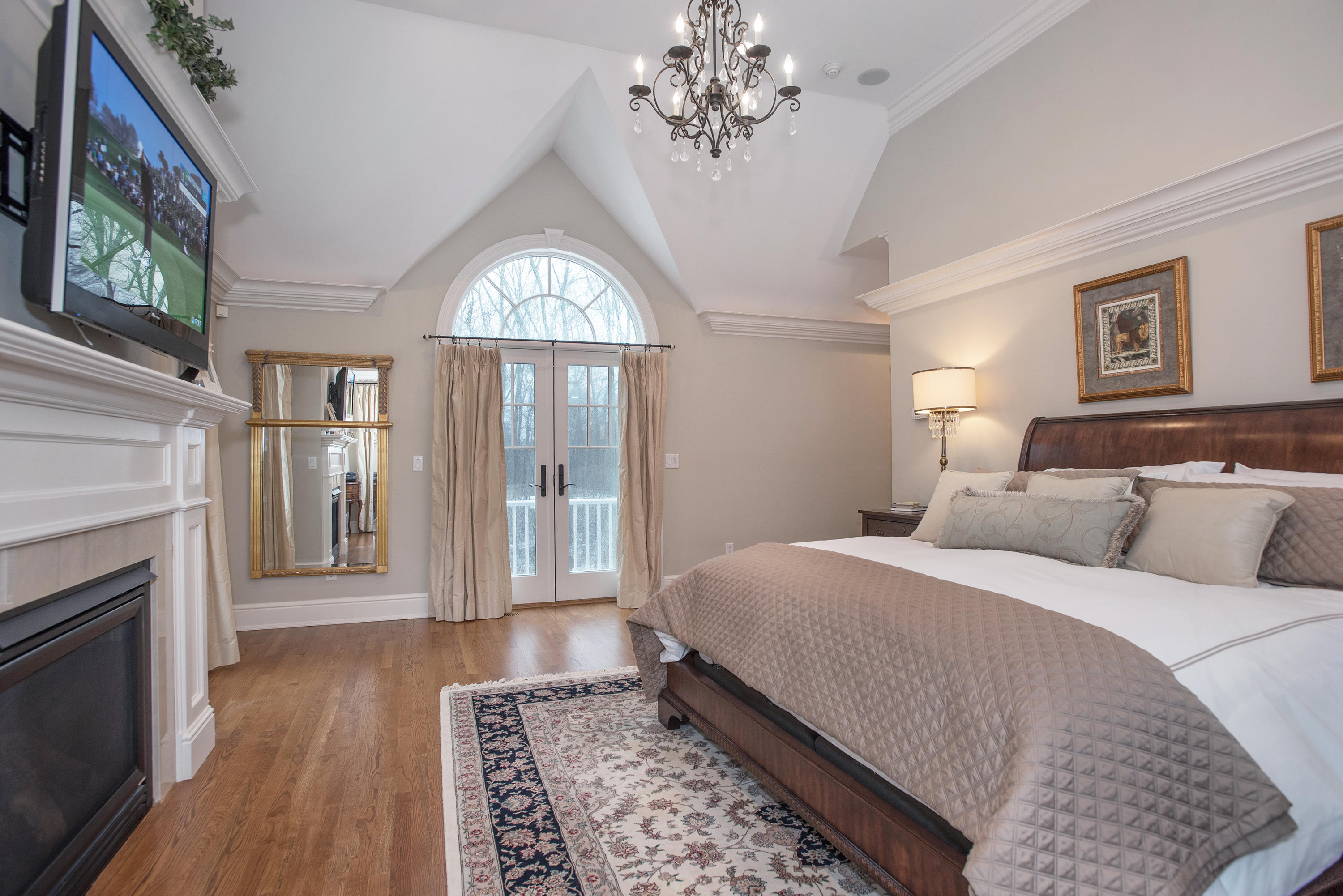 130 Skyview Lane New Canaan, CT 06840 - Photo 25 of 44 a bed room with a bed and a fireplace